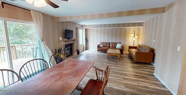 a living room with furniture fireplace and a flat screen tv