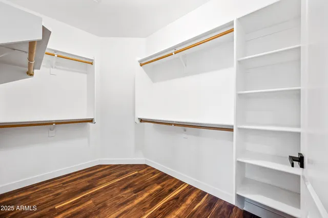 a view of an empty walk in closet