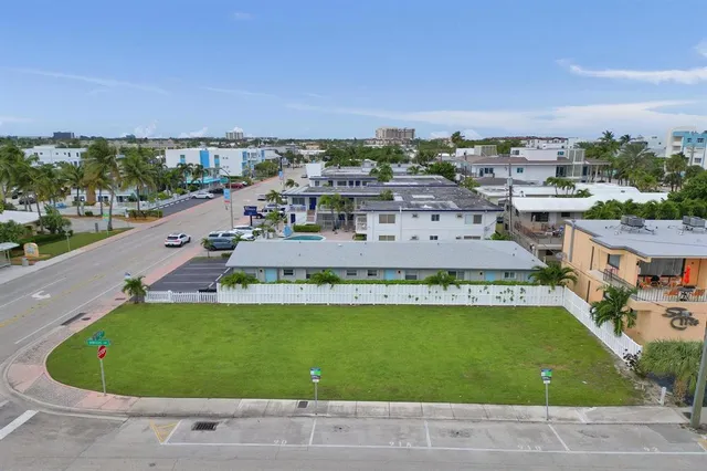 a view of a swimming pool with lawn chairs
