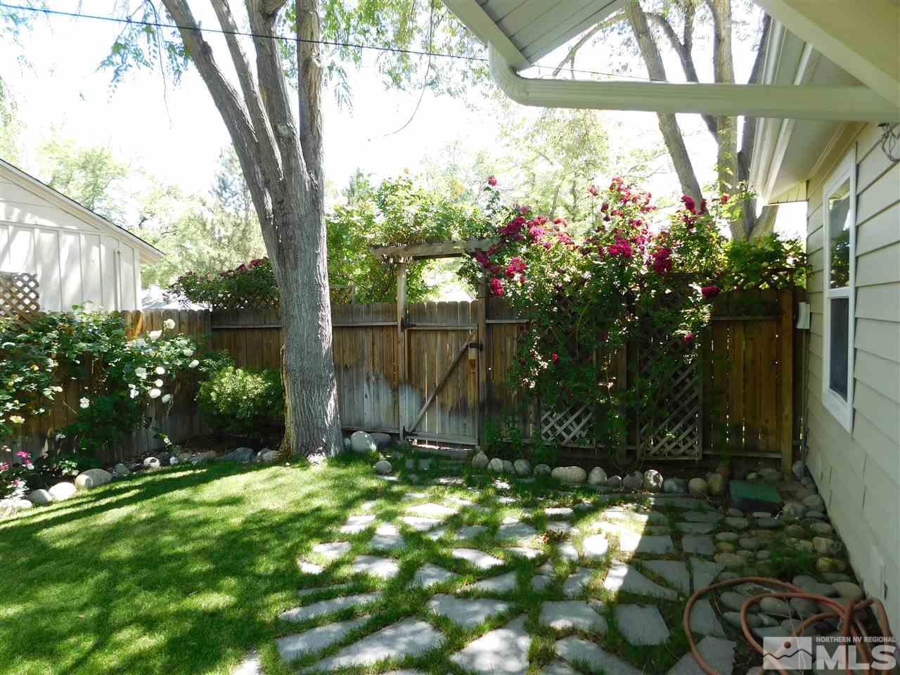 2001 Vale Street Reno, NV 89509 - Photo 15 of 16 a view of a house with a yard and garden