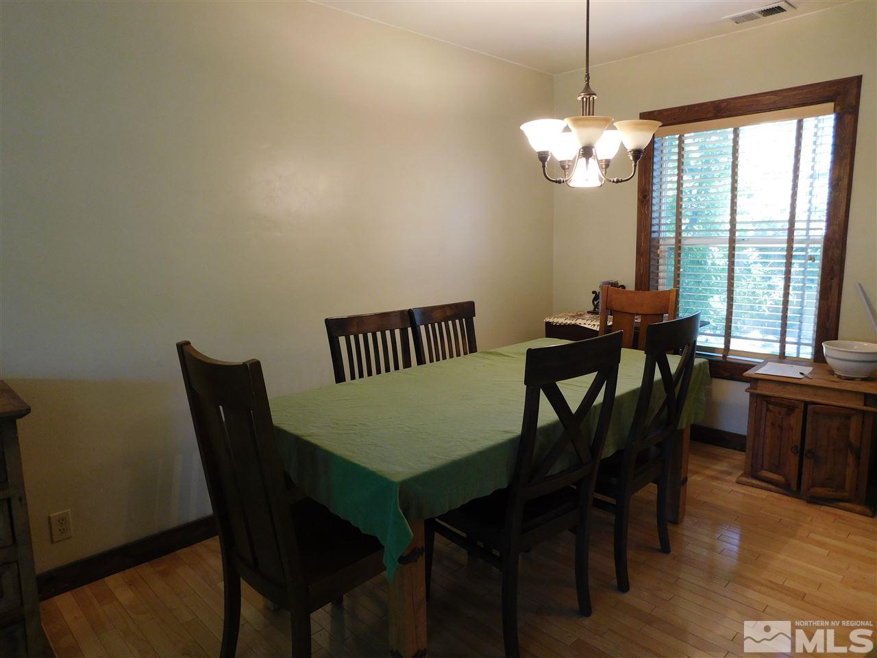 2001 Vale Street Reno, NV 89509 - Photo 5 of 16 a view of a dining room with furniture window and wooden floor