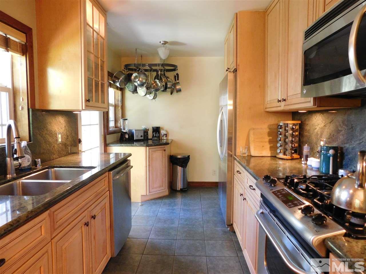 2001 Vale Street Reno, NV 89509 - Photo 6 of 16 a kitchen with stainless steel appliances a sink a stove and a microwave