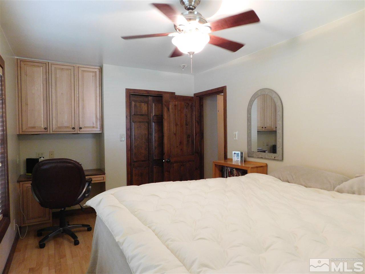 2001 Vale Street Reno, NV 89509 - Photo 9 of 16 a bedroom with a bed and a chair