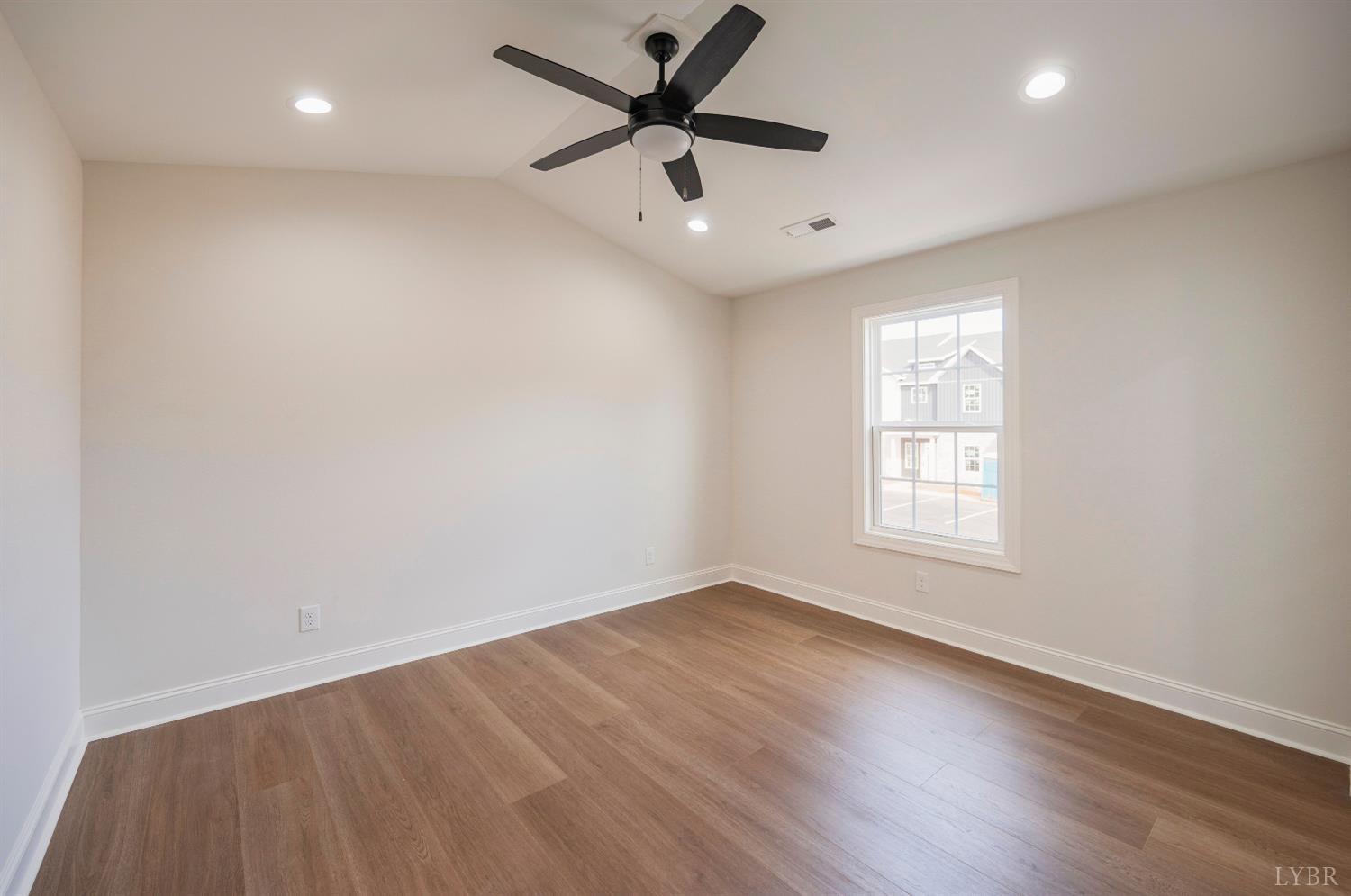 536 Leesville Road, Unit 501 Lynchburg, VA 24502 - Photo 19 of 48 an empty room with wooden floor and windows