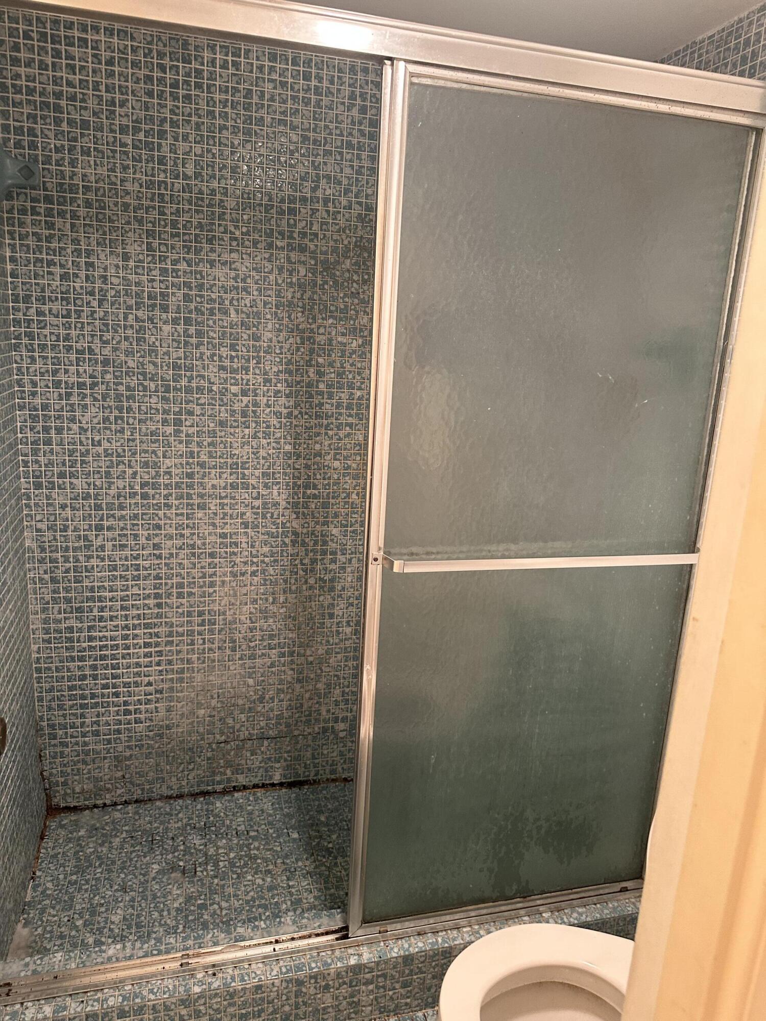 3090 Holiday Springs Boulevard, Unit 310 Margate, FL 33063 - Photo 12 of 26 a bathroom with a shower