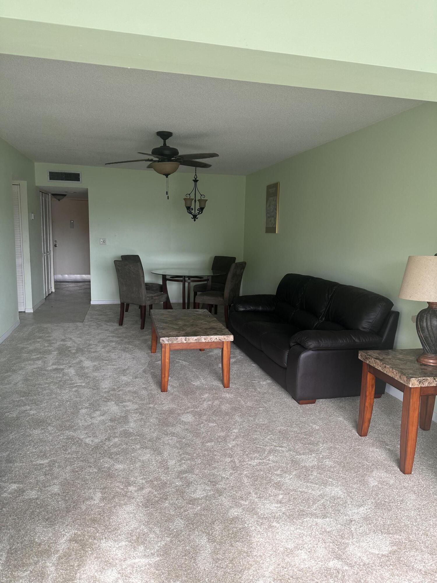 3090 Holiday Springs Boulevard, Unit 310 Margate, FL 33063 - Photo 15 of 26 a living room with furniture