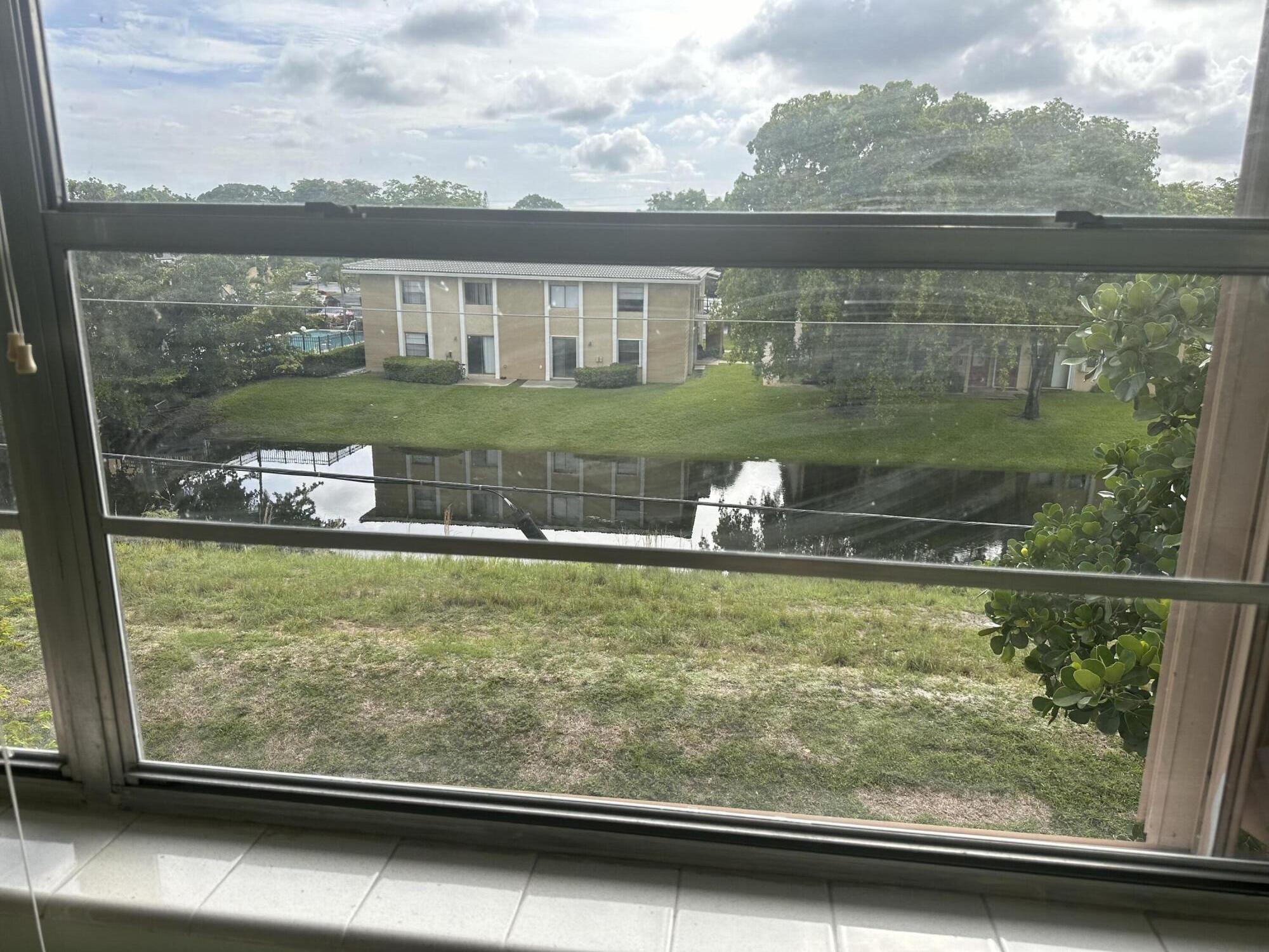 3090 Holiday Springs Boulevard, Unit 310 Margate, FL 33063 - Photo 26 of 26 a view of swimming pool from a window