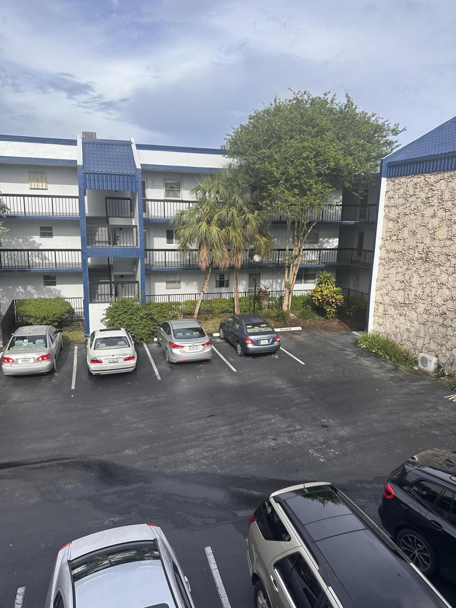 3090 Holiday Springs Boulevard, Unit 310 Margate, FL 33063 - Photo 4 of 26 a view of a street with cars