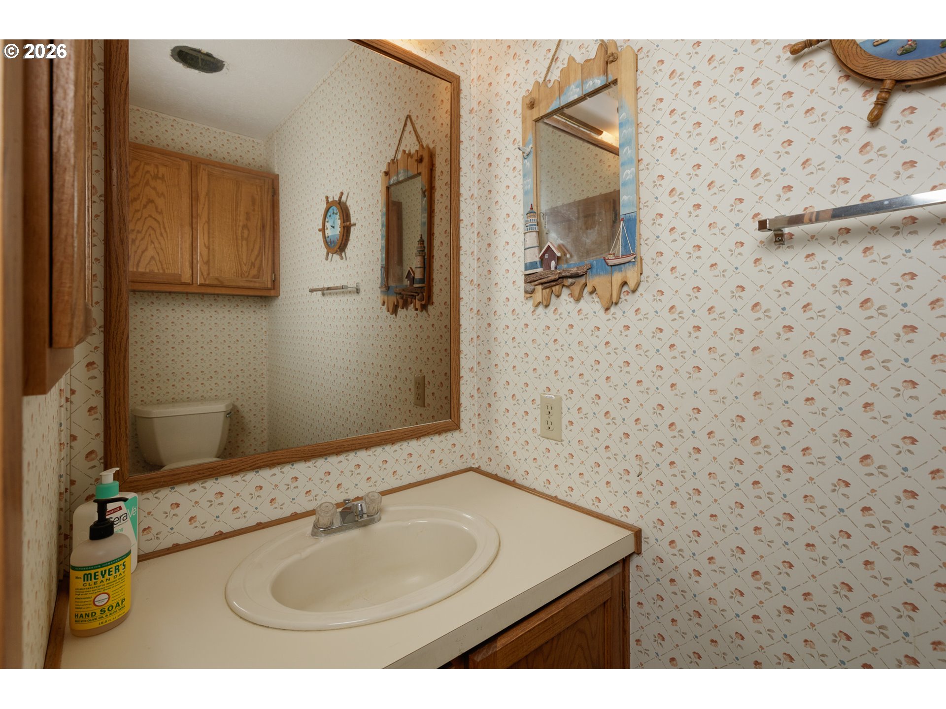 245 South Mike Road Tygh Valley, OR 97063 - Photo 12 of 22 a bathroom with a sink and a mirror