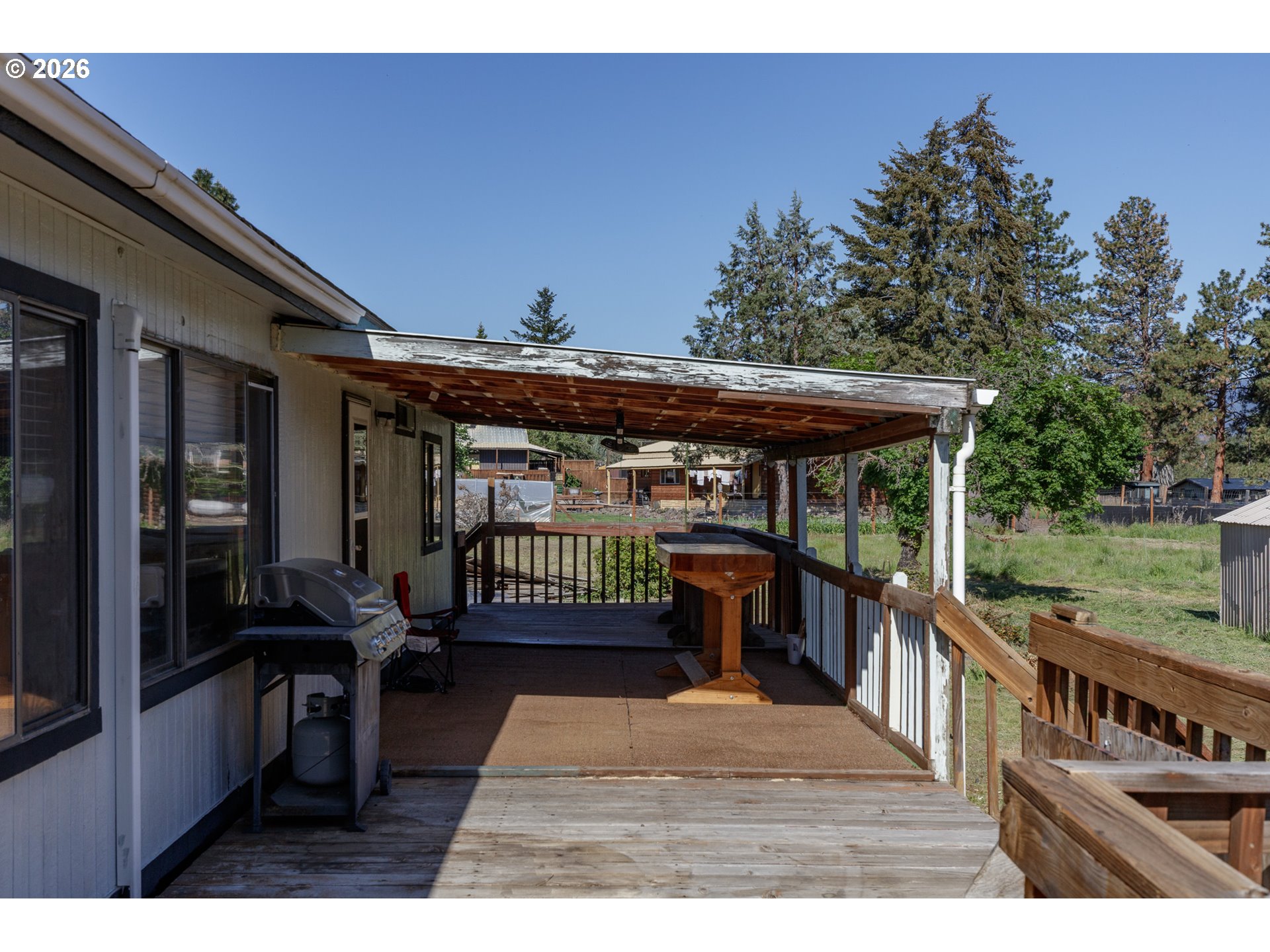 245 South Mike Road Tygh Valley, OR 97063 - Photo 16 of 22 a view of a deck with wooden floor and outdoor seating