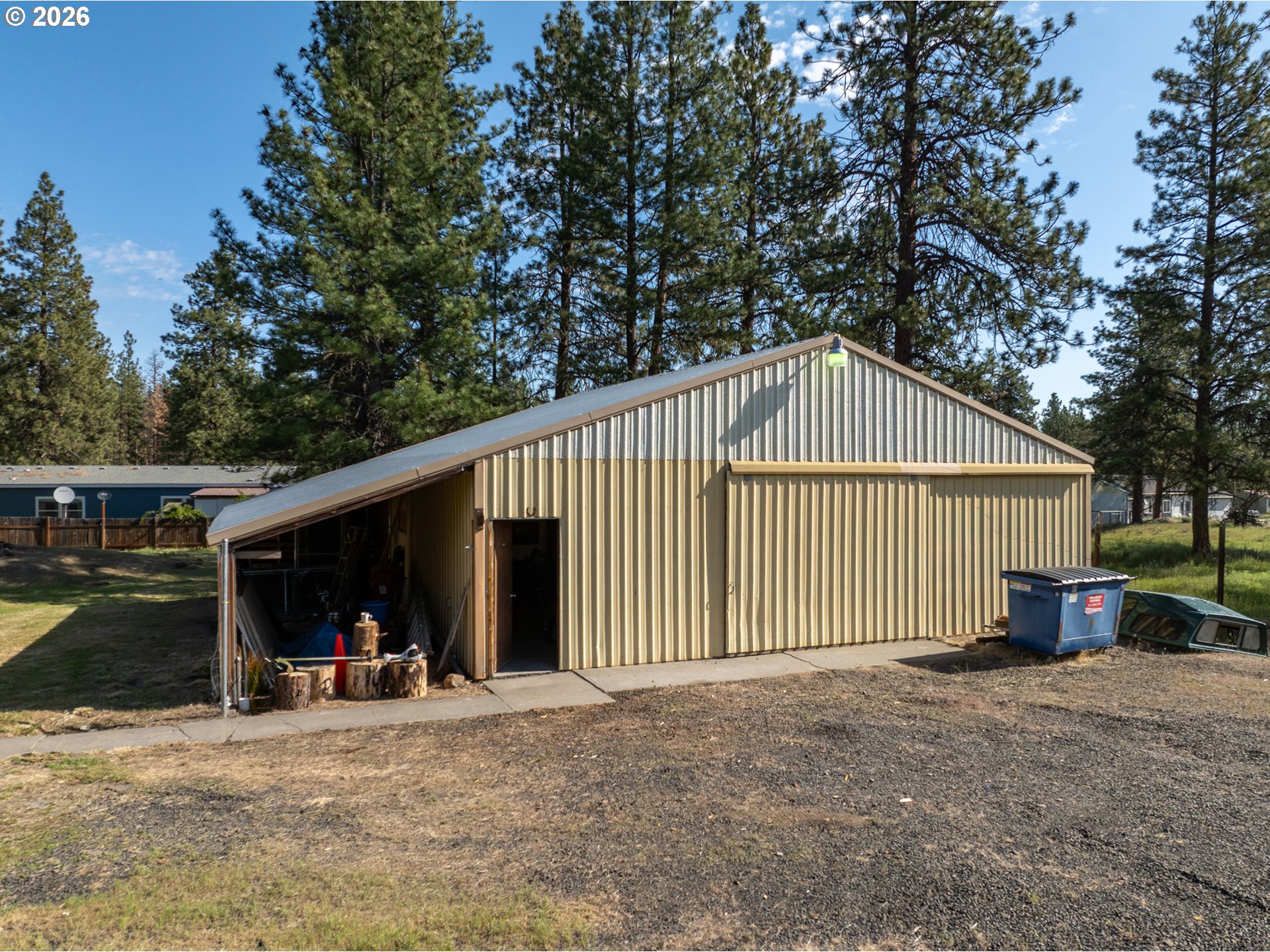 245 South Mike Road Tygh Valley, OR 97063 - Photo 17 of 22 a view of a house with a yard and garage
