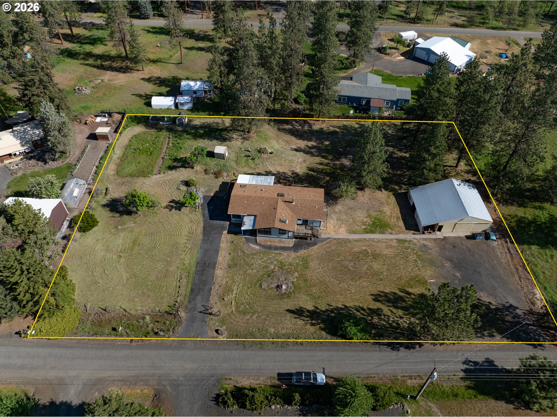 245 South Mike Road Tygh Valley, OR 97063 - Photo 18 of 22 an aerial view of a house with a garden