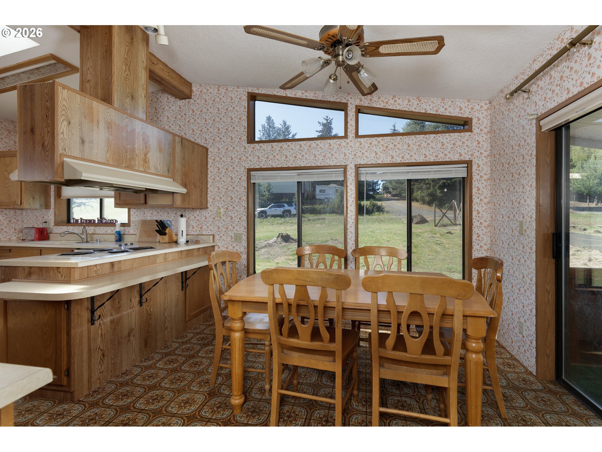 245 South Mike Road Tygh Valley, OR 97063 - Photo 7 of 22 a view of a dining room with furniture and a chandelier