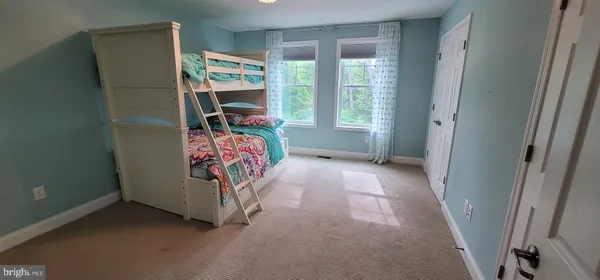 a view of an empty room with windows