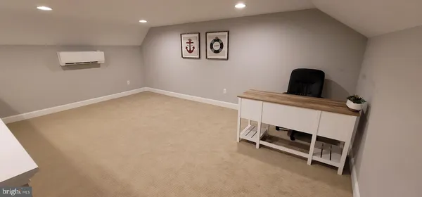 a room with a desk and furniture