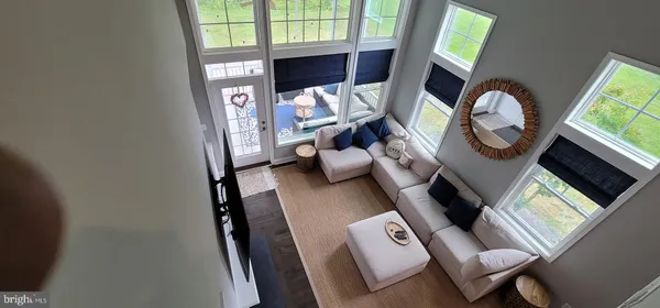 a view of living room with furniture and a window