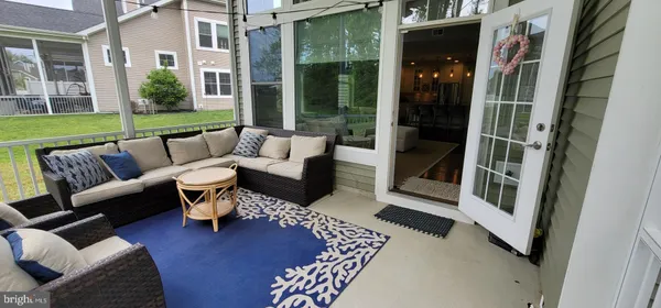 a balcony with furniture and a garden