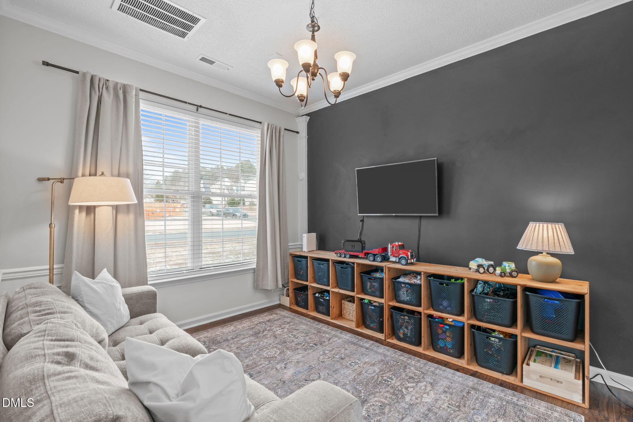 400 New Timber Path Apex, NC 27502 - Photo 13 of 34 a living room with furniture a flat screen tv and a window