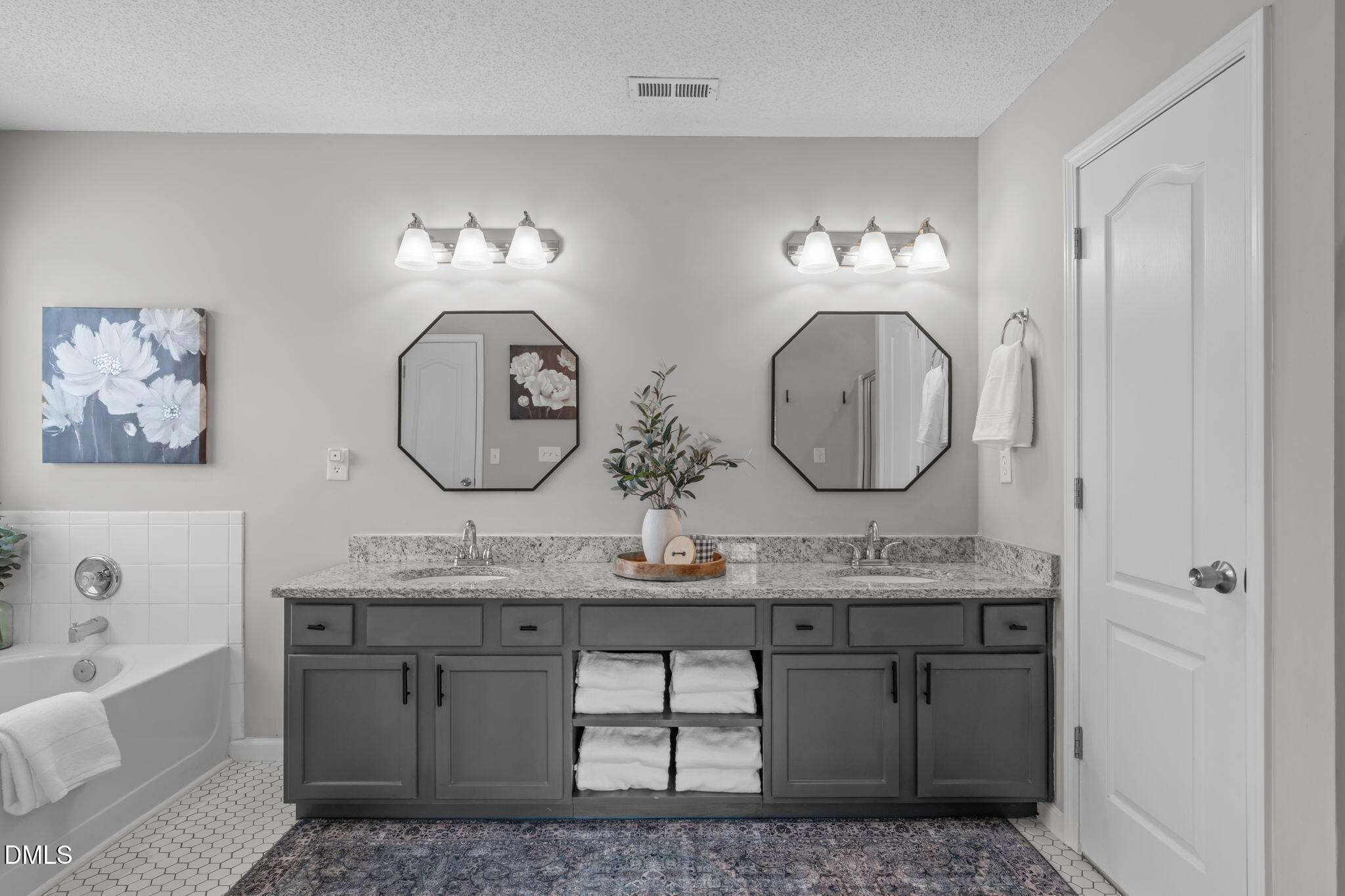 400 New Timber Path Apex, NC 27502 - Photo 19 of 34 a bathroom with a double vanity sink and a mirror