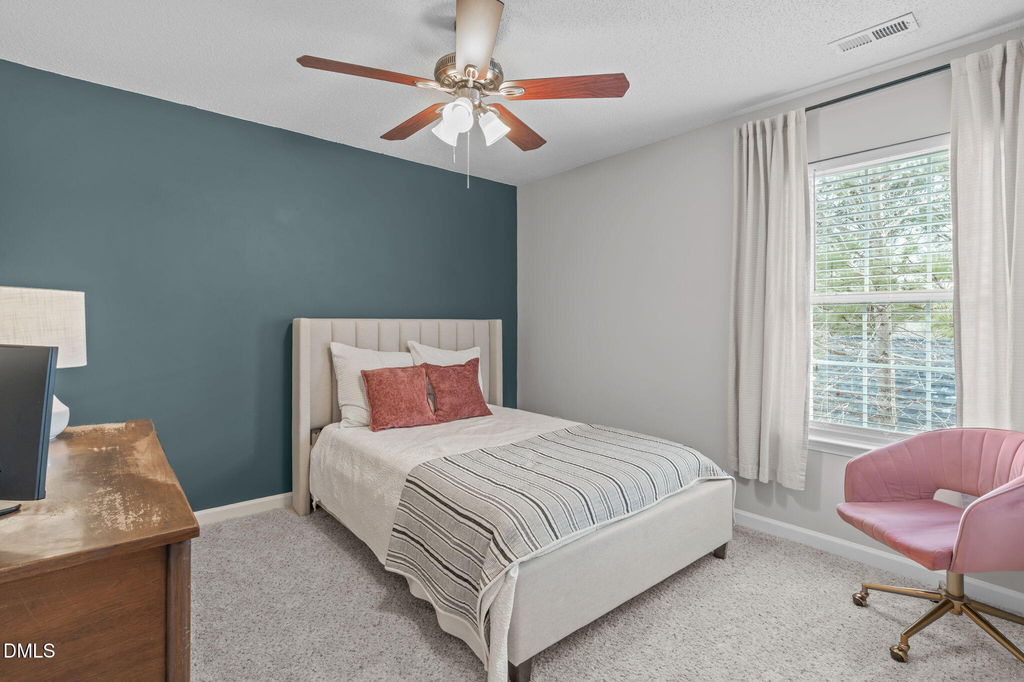 400 New Timber Path Apex, NC 27502 - Photo 24 of 34 a bedroom with a bed a chair and a window