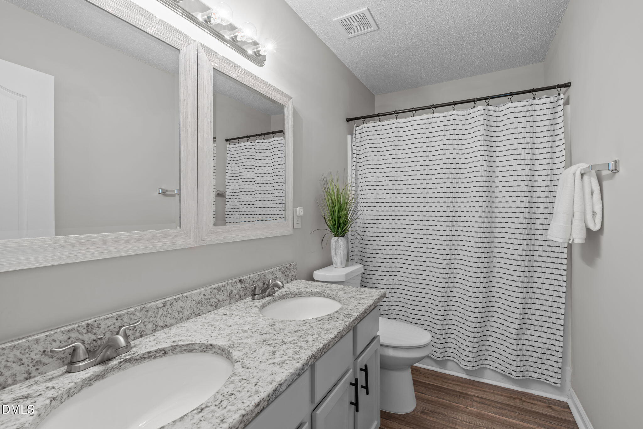 400 New Timber Path Apex, NC 27502 - Photo 26 of 34 a bathroom with a granite countertop sink toilet and shower