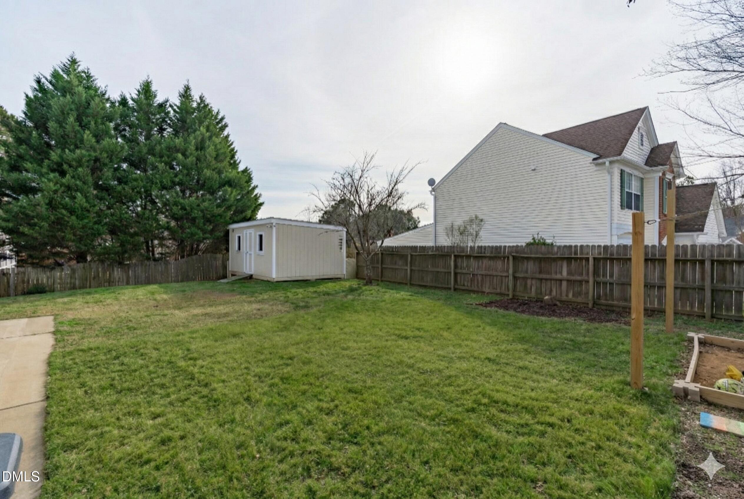 400 New Timber Path Apex, NC 27502 - Photo 30 of 34 a backyard of a house with lots of green space