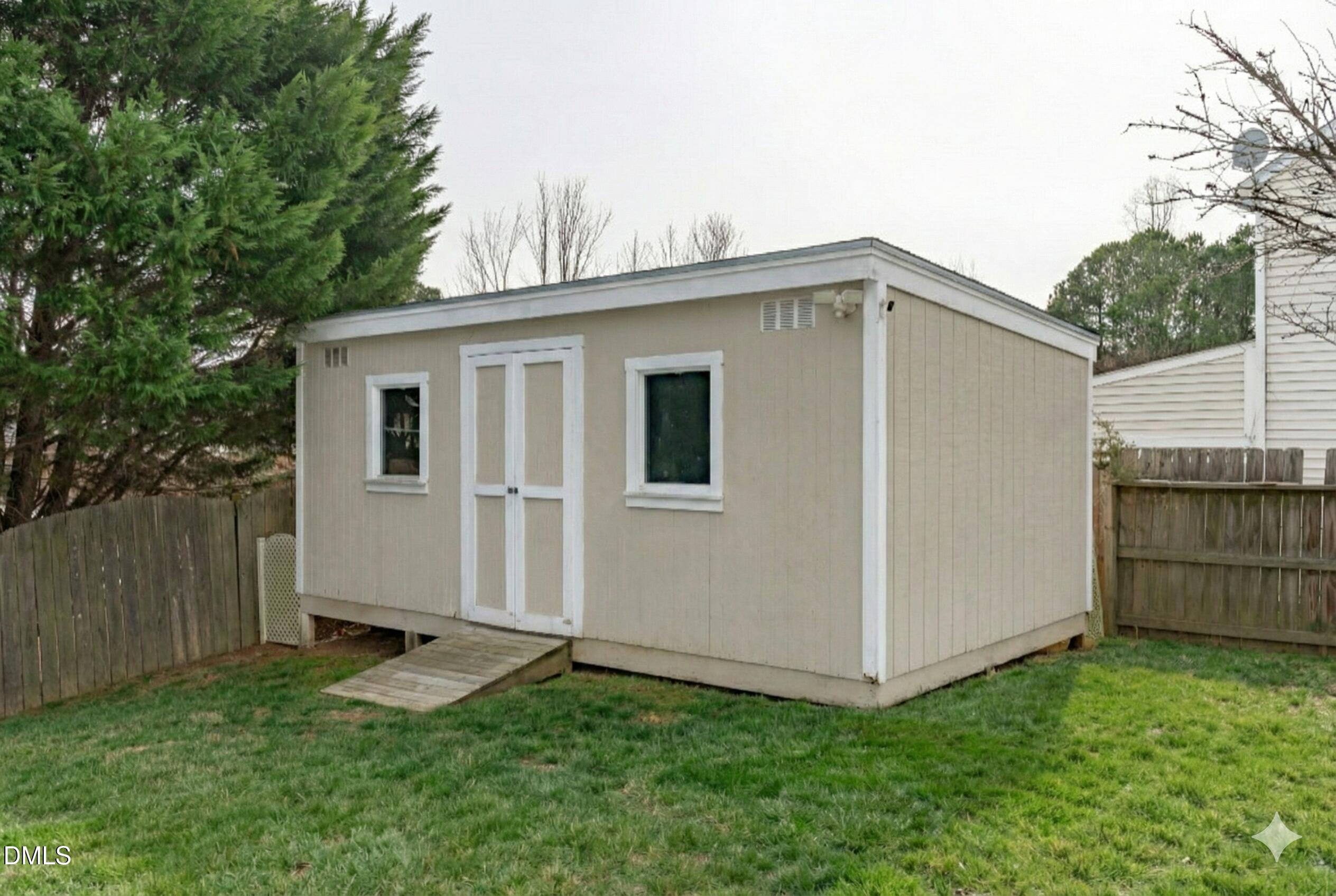 400 New Timber Path Apex, NC 27502 - Photo 32 of 34 a view of backyard of house with wooden fence