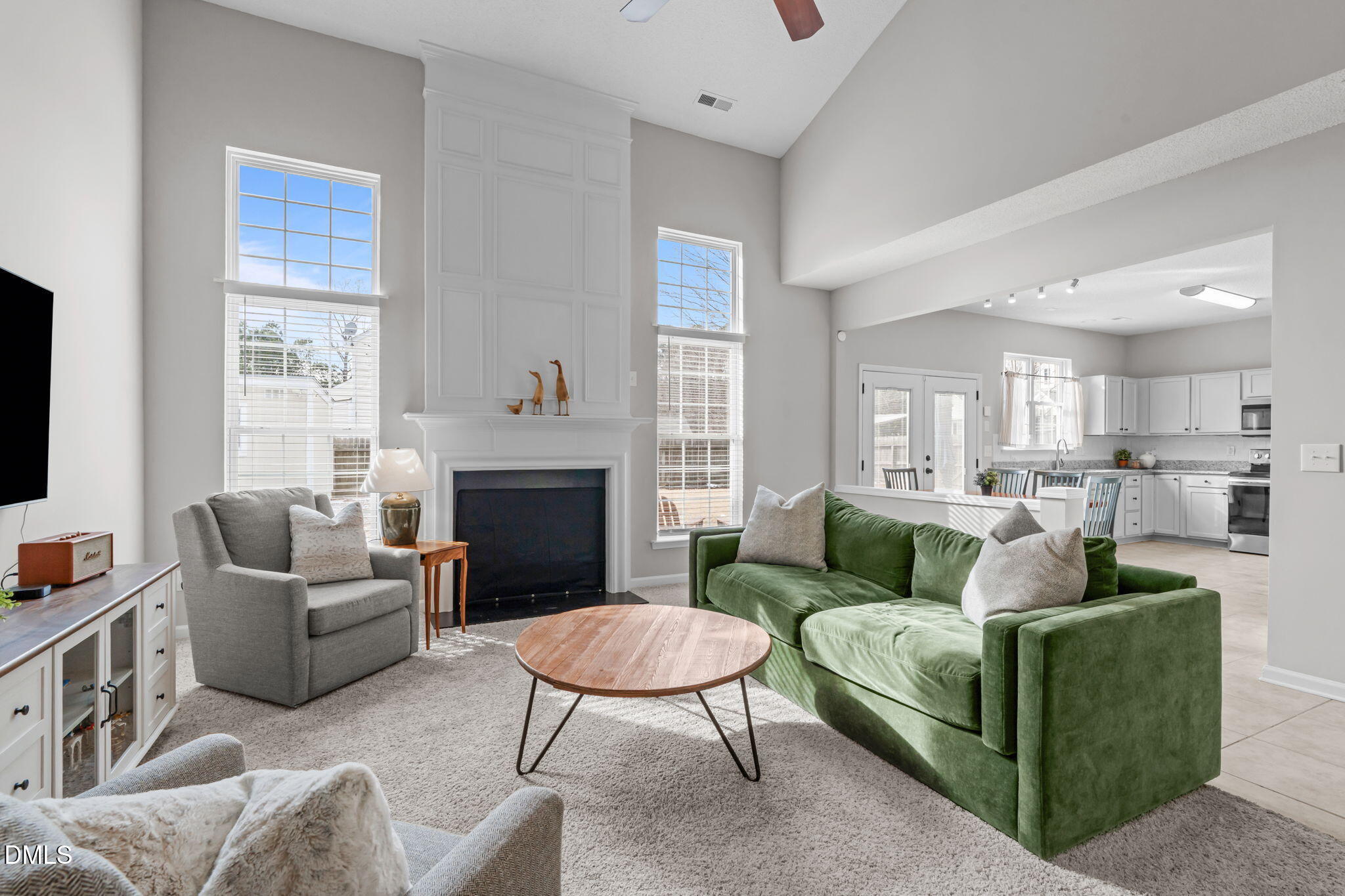 400 New Timber Path Apex, NC 27502 - Photo 3 of 34 a living room with furniture a fireplace and a flat screen tv