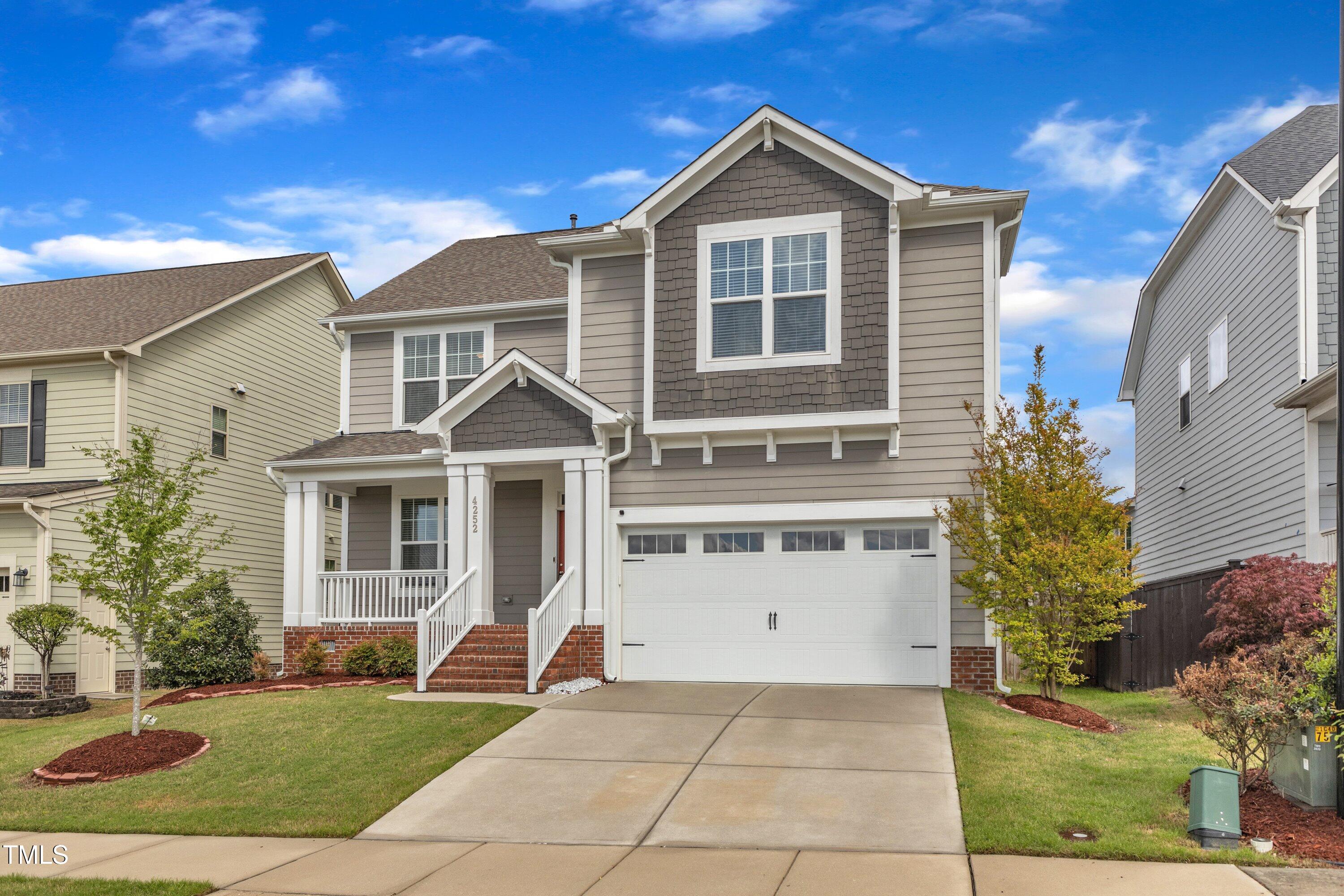 4252 Rockdell Hall Street Raleigh, NC 27616 - Photo 11 of 64 a front view of a house with a yard