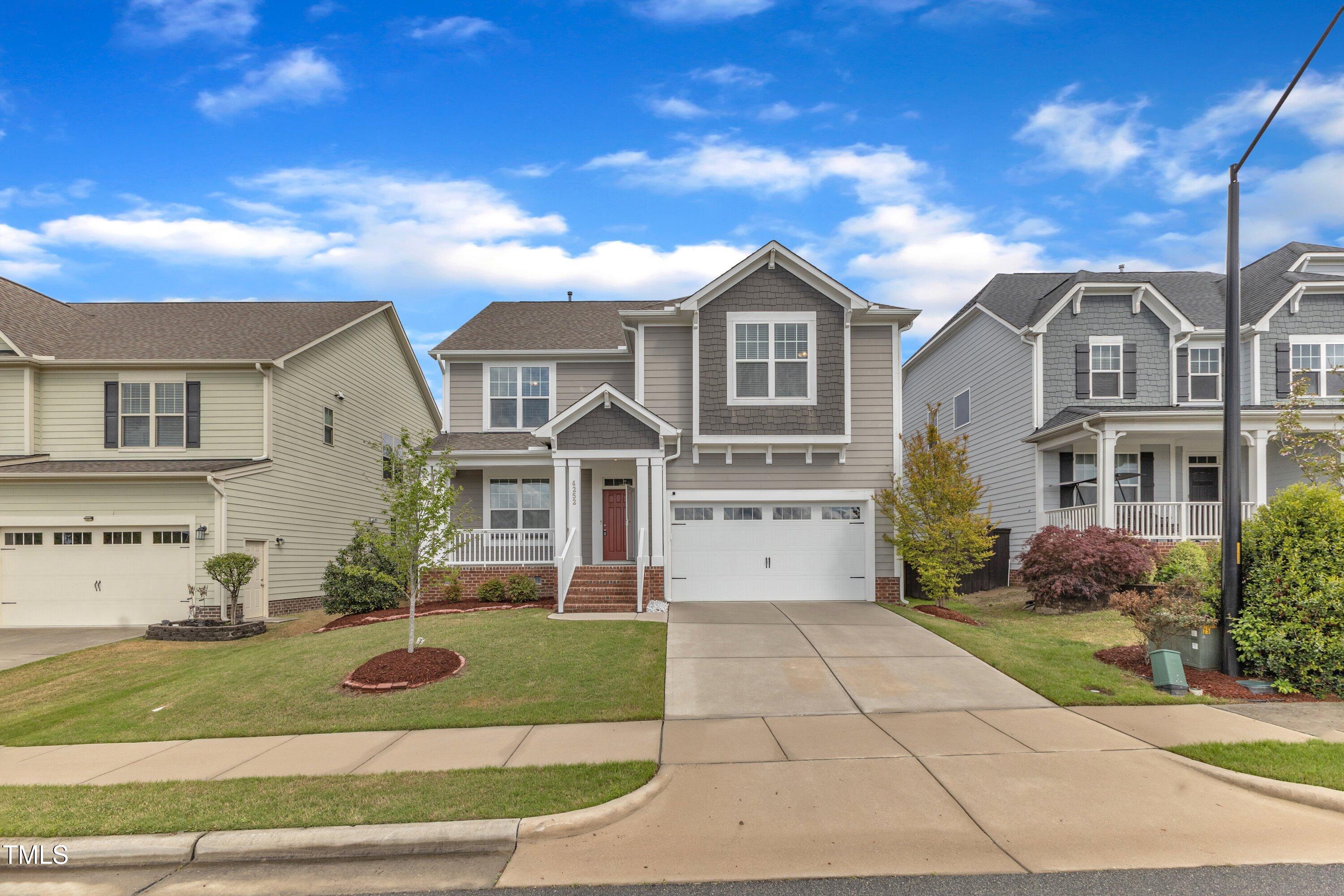 4252 Rockdell Hall Street Raleigh, NC 27616 - Photo 12 of 64 a front view of a house with garden