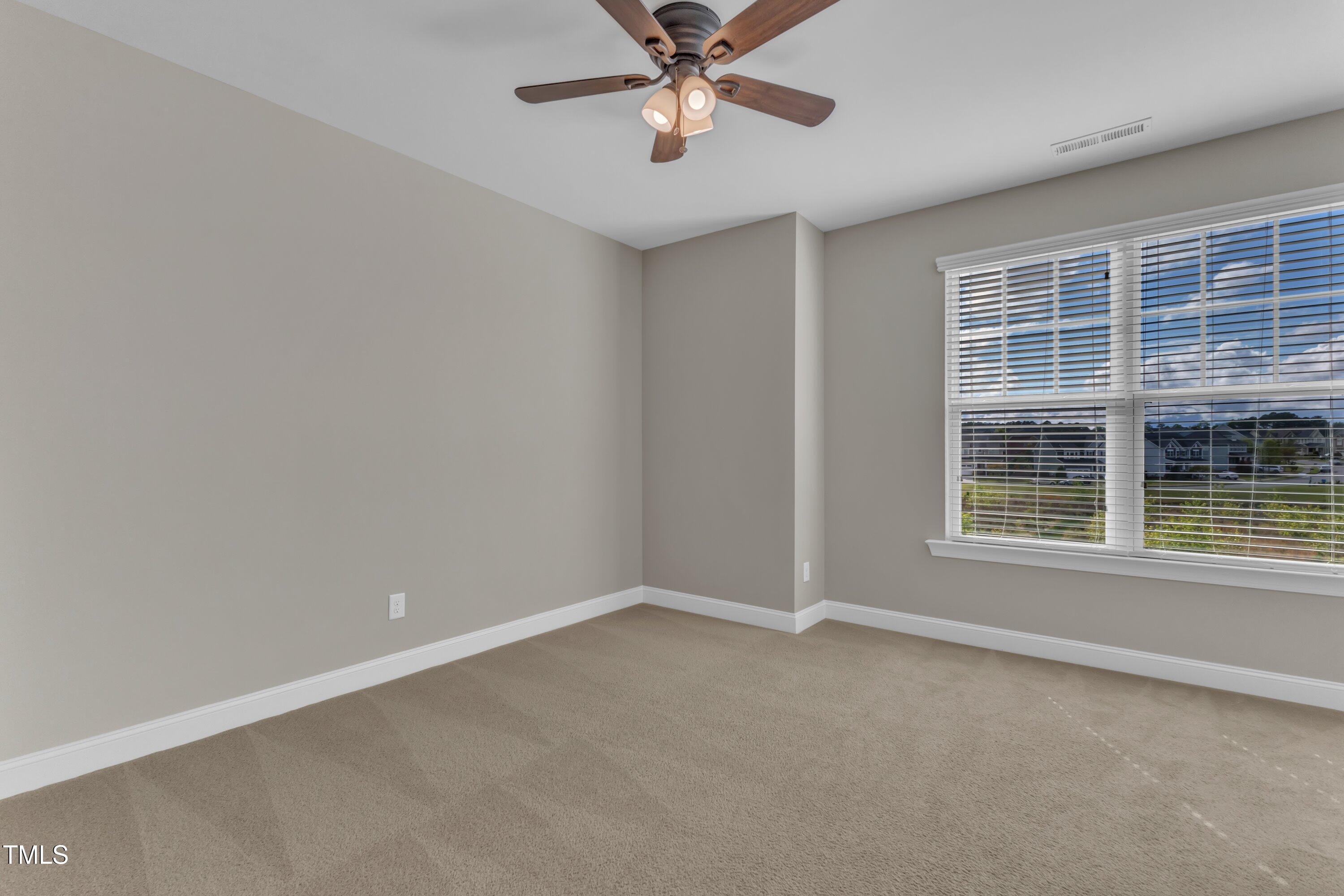 4252 Rockdell Hall Street Raleigh, NC 27616 - Photo 36 of 64 a view of an empty room with a window