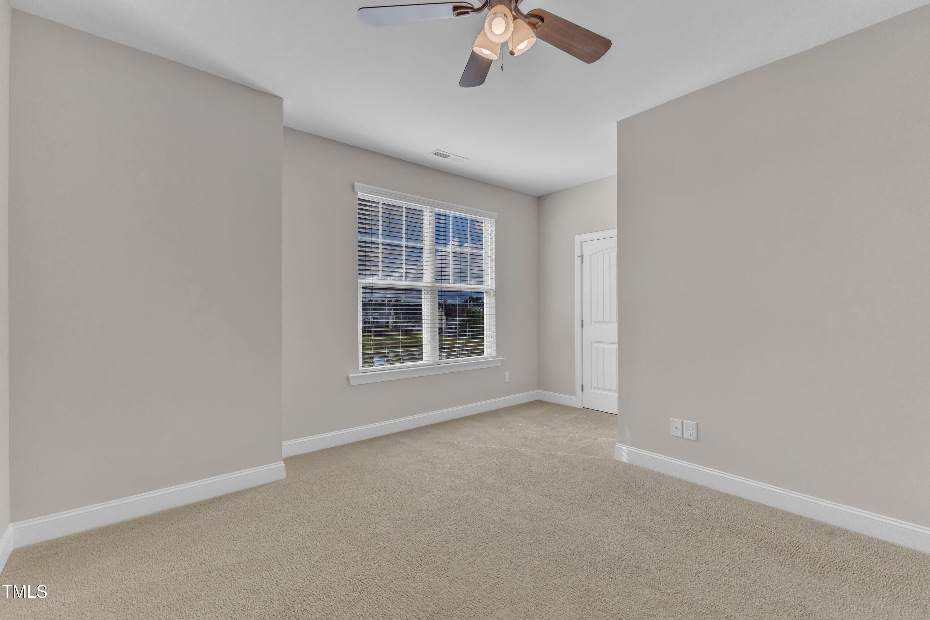 4252 Rockdell Hall Street Raleigh, NC 27616 - Photo 37 of 64 an empty room with a empty space and windows