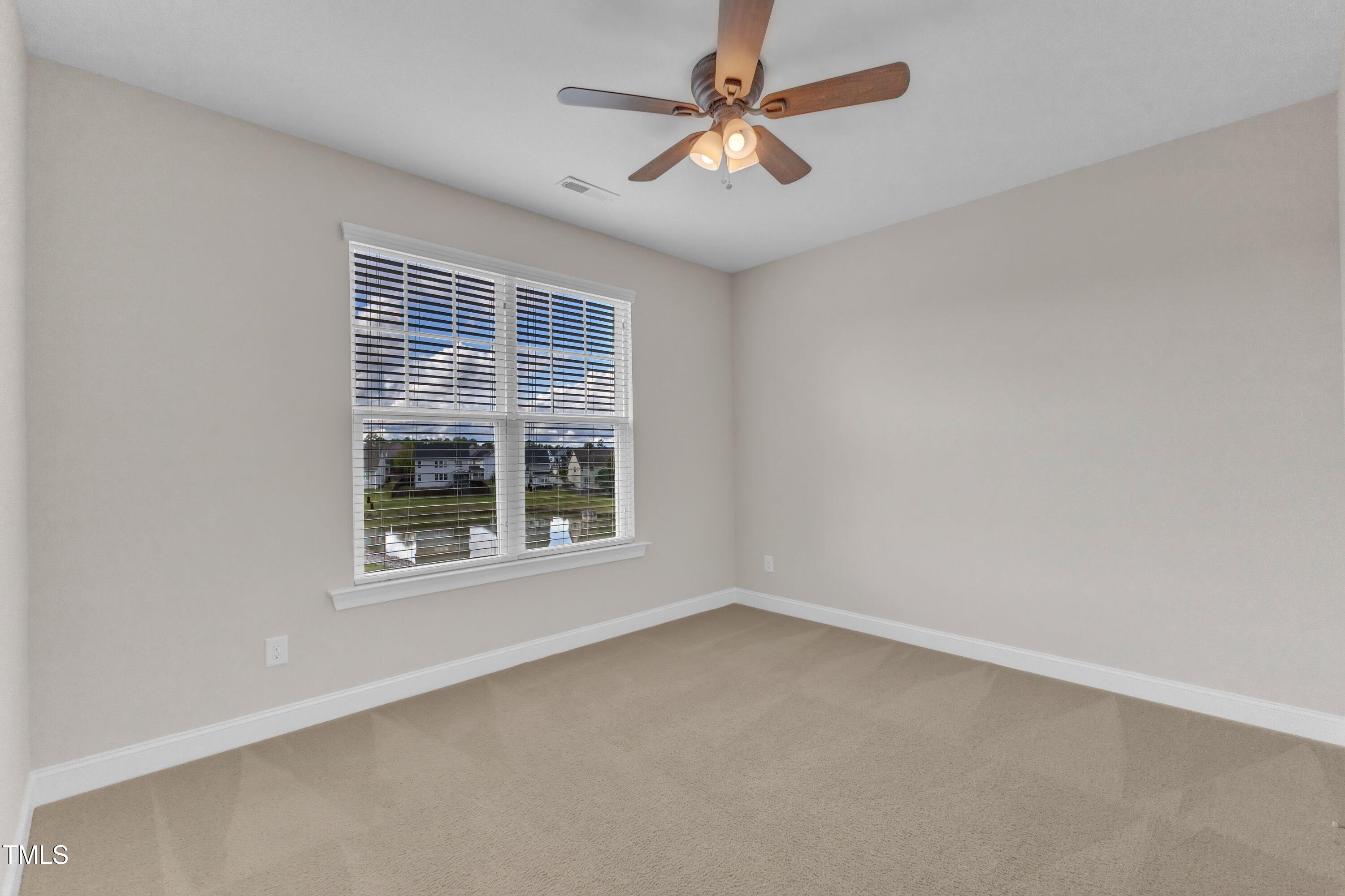 4252 Rockdell Hall Street Raleigh, NC 27616 - Photo 43 of 64 an empty room with a window