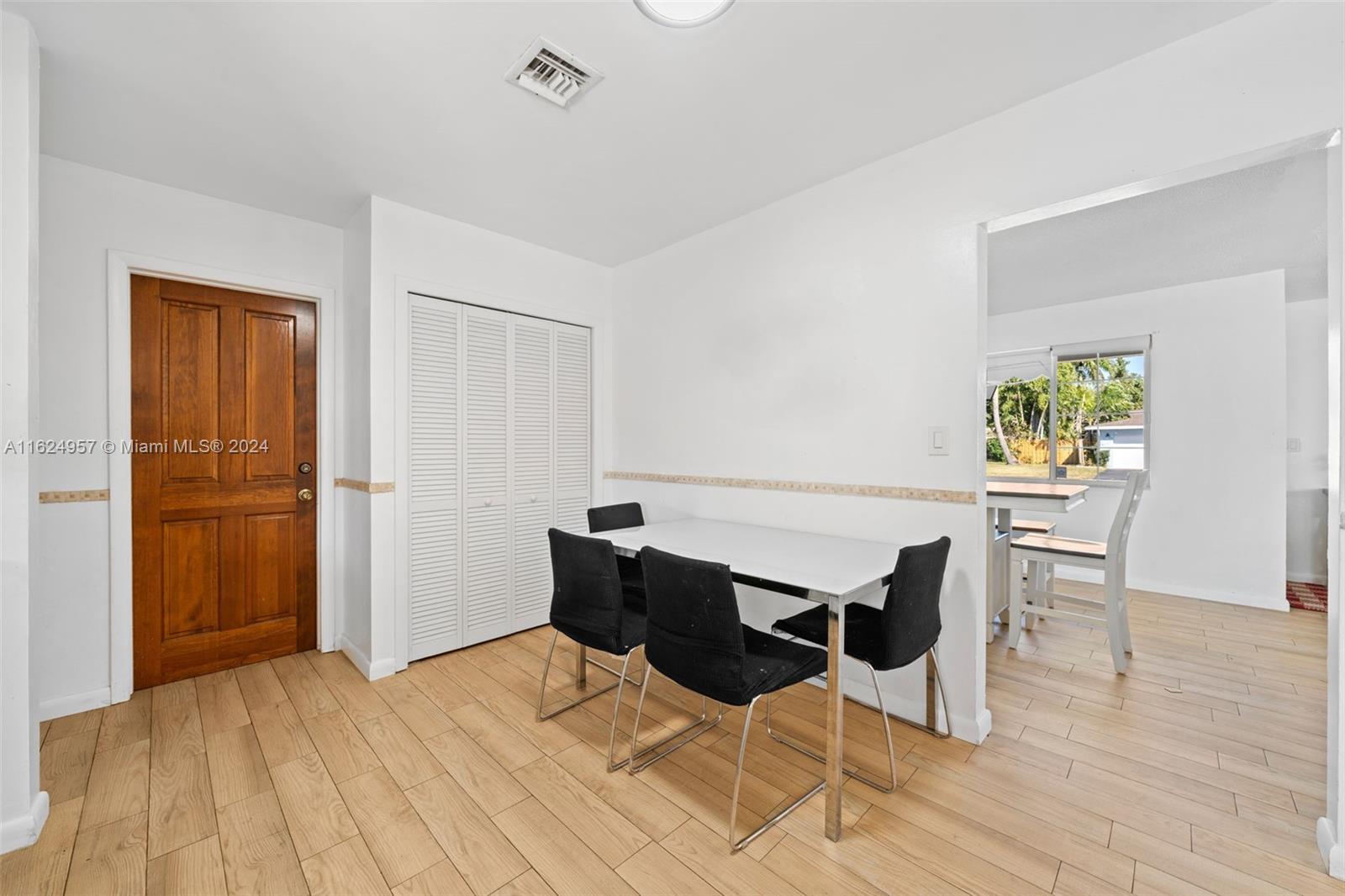 541 Ridgewood Lane Plantation, FL 33317 - Photo 8 of 24 a dining room with furniture and window
