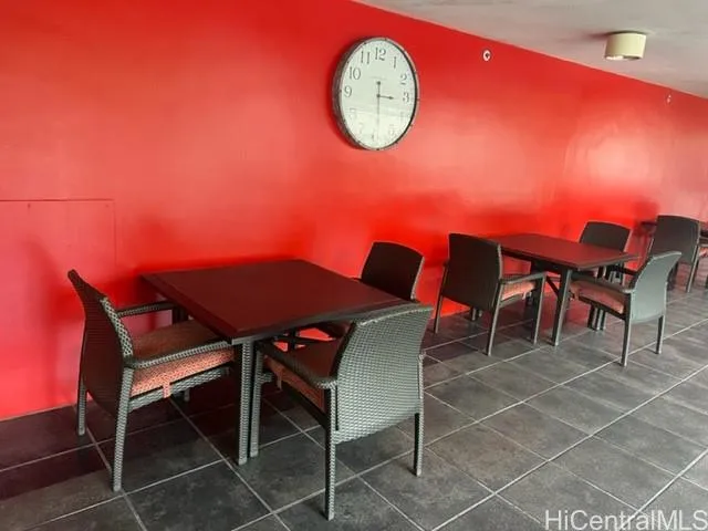 a view of a dining room with furniture and a large window