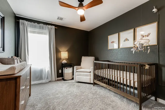 a bedroom with furniture and a window