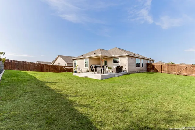 a front view of house with yard and seating area