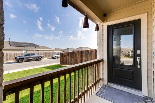 a view of a balcony with furniture