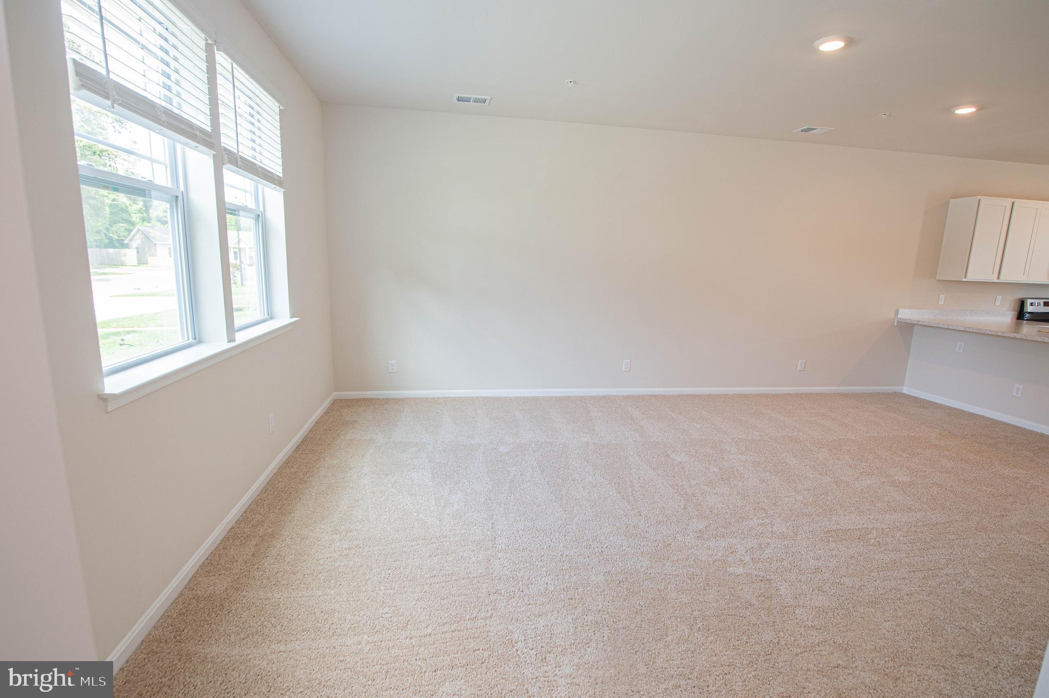 130 Willowtree Lane Fruitland, MD 21826 - Photo 13 of 74 an empty room with windows