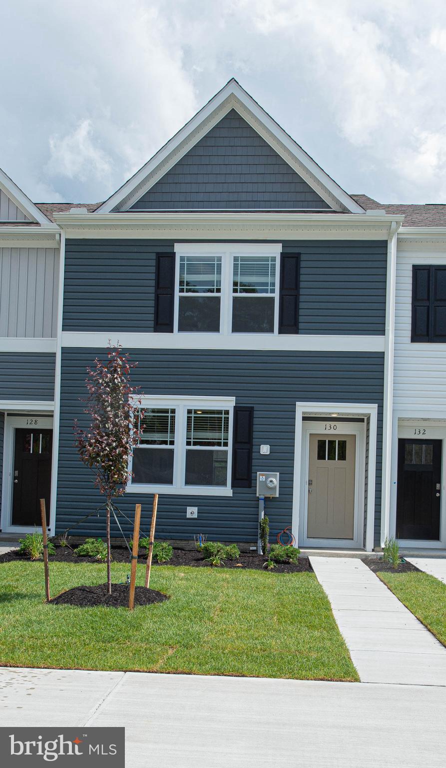 130 Willowtree Lane Fruitland, MD 21826 - Photo 2 of 74 a view of a house with a yard and a large tree