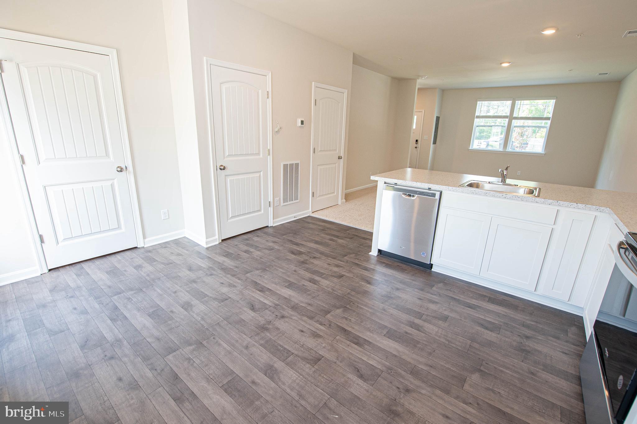 130 Willowtree Lane Fruitland, MD 21826 - Photo 25 of 74 an empty room with wooden floor and windows
