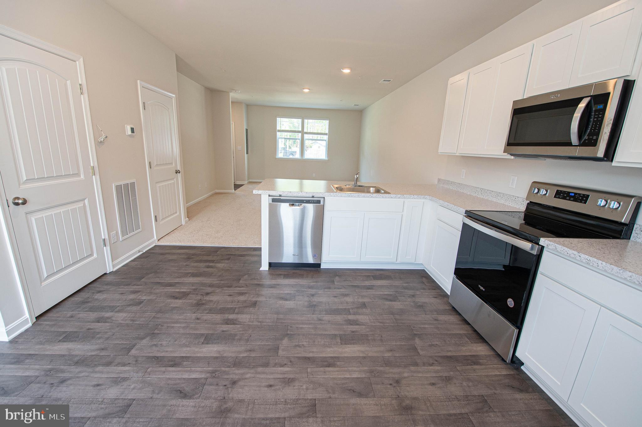 130 Willowtree Lane Fruitland, MD 21826 - Photo 26 of 74 a view of a kitchen with microwave and cabinets