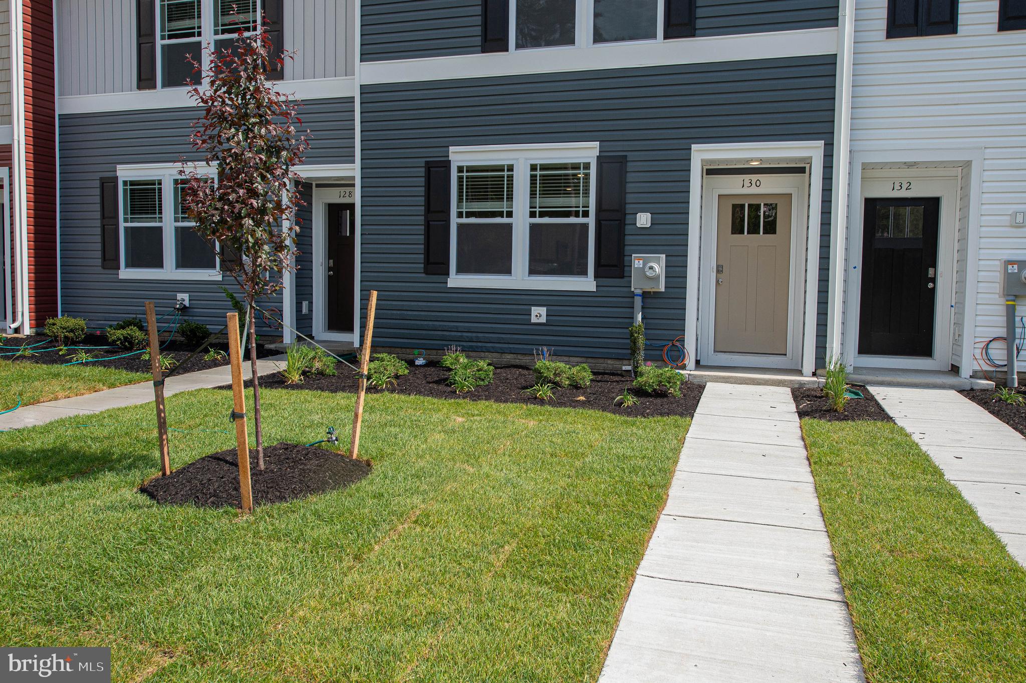 130 Willowtree Lane Fruitland, MD 21826 - Photo 3 of 74 a front view of a house with a yard