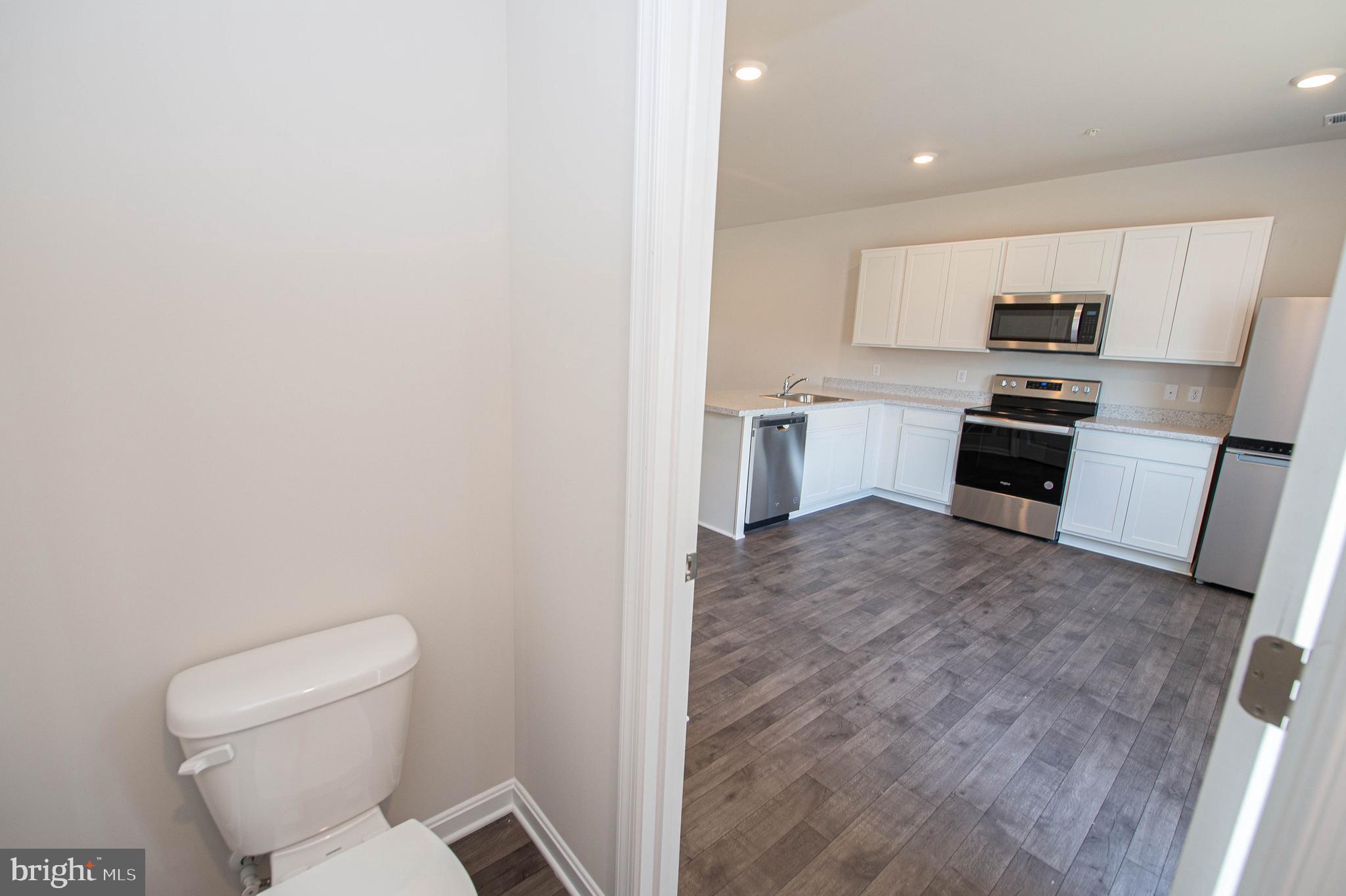 130 Willowtree Lane Fruitland, MD 21826 - Photo 33 of 74 a view of kitchen with sink microwave and refrigerator