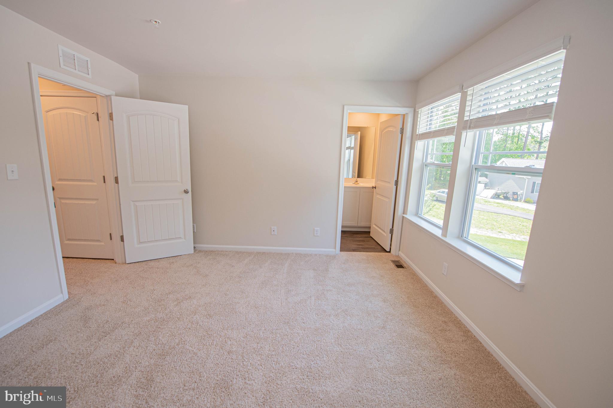 130 Willowtree Lane Fruitland, MD 21826 - Photo 47 of 74 an empty room with windows and closet