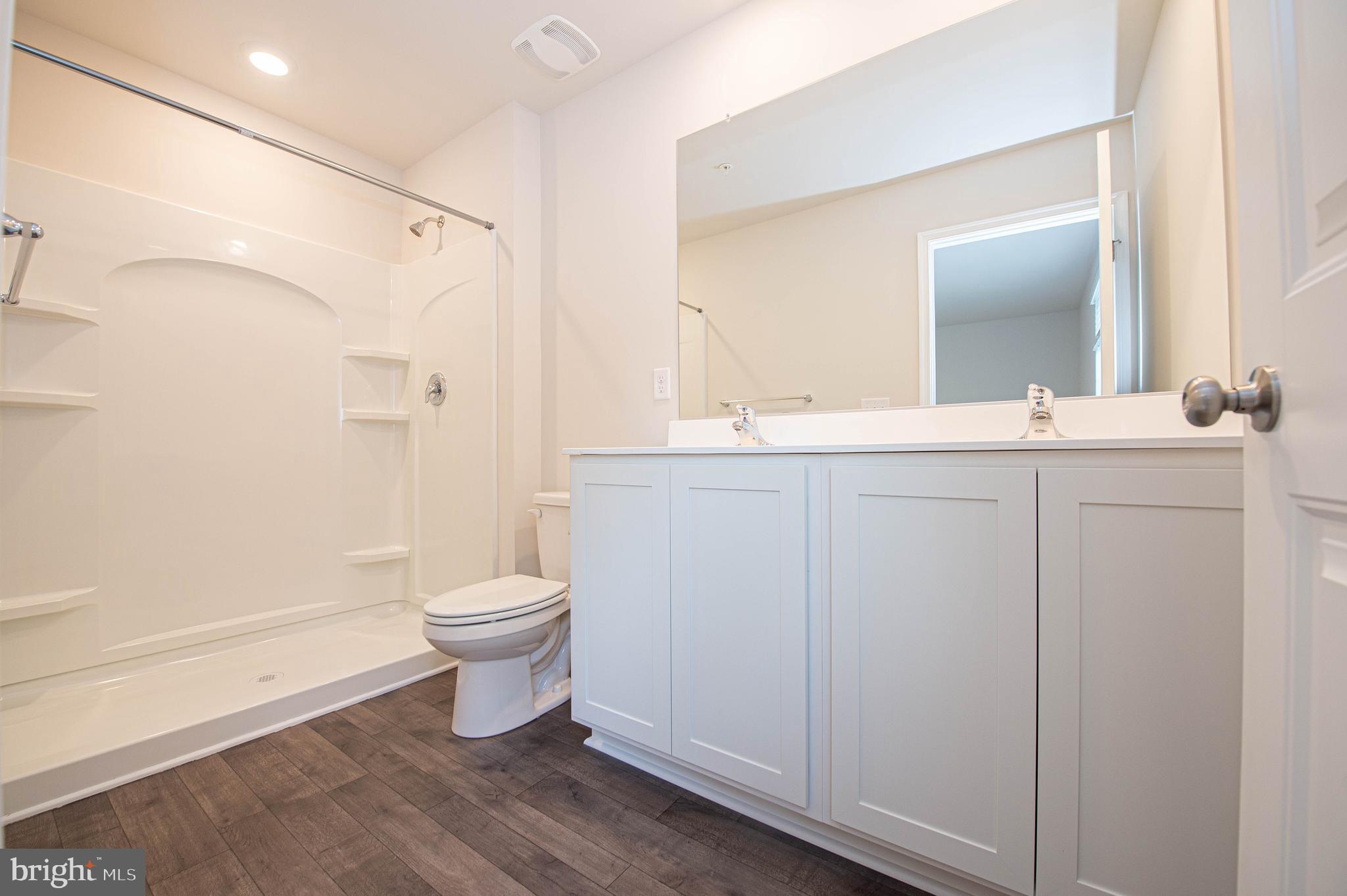 130 Willowtree Lane Fruitland, MD 21826 - Photo 52 of 74 a bathroom with a granite countertop sink toilet and shower
