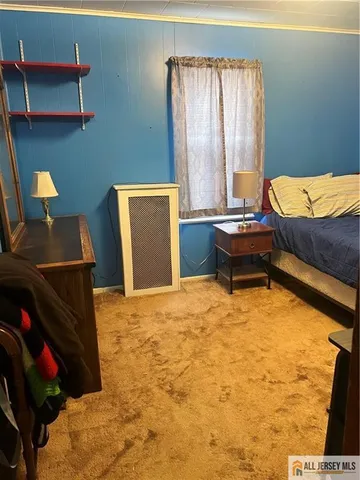 a bedroom with furniture and a bed