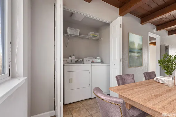 a room that has a table and a chair in it