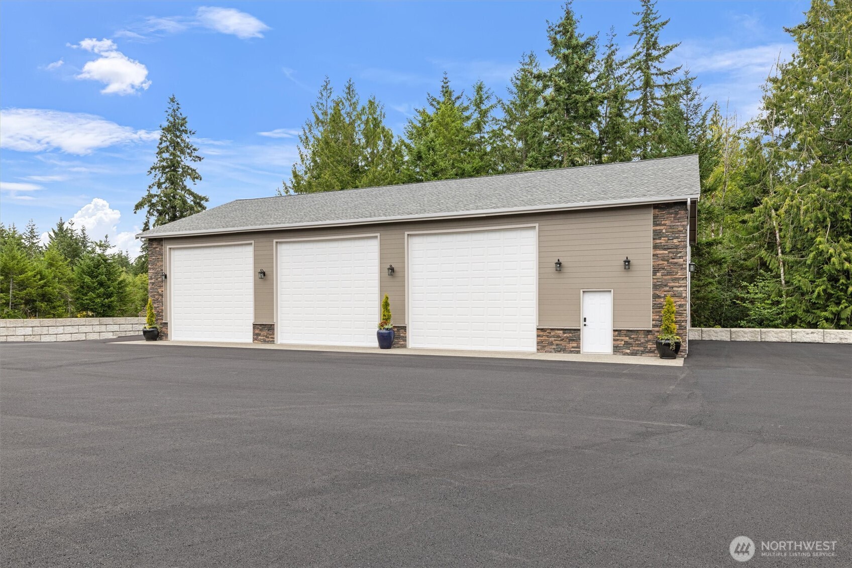151 East Windy Ridge Lane Belfair, WA 98528 - Photo 39 of 40 a view of a house with a outdoor space and tree