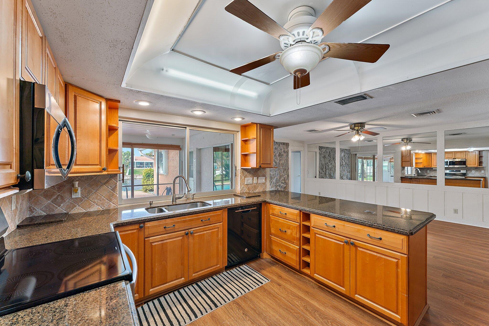 12867 Packwood Road North Palm Beach, FL 33408 - Photo 15 of 30 Kitchen Living Room 1